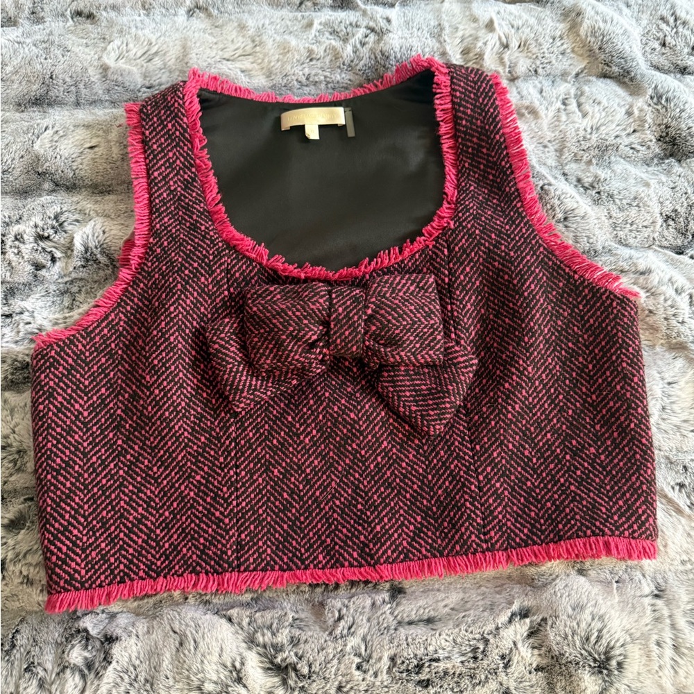 LoveShackFancy. Pink, burgundy, and black cropped wool/silk bow top.